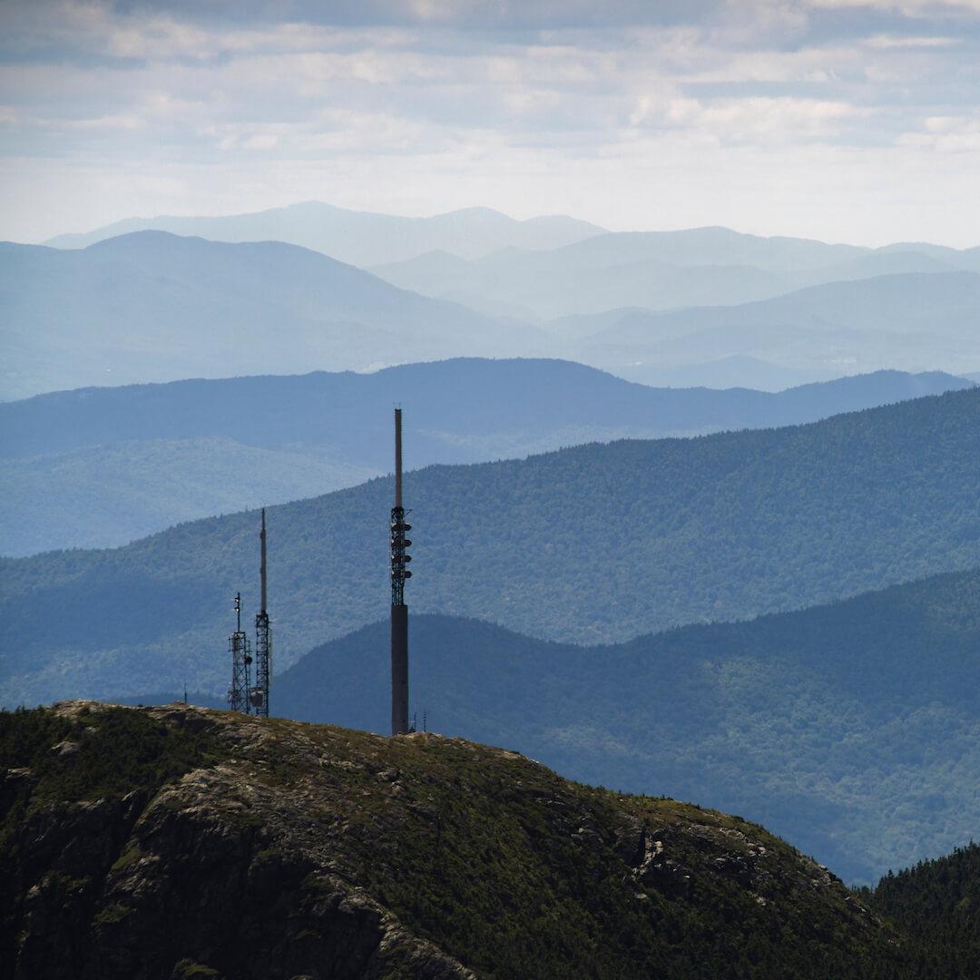 A view from the peak of Mount Mansfield, cell towers in the distance.