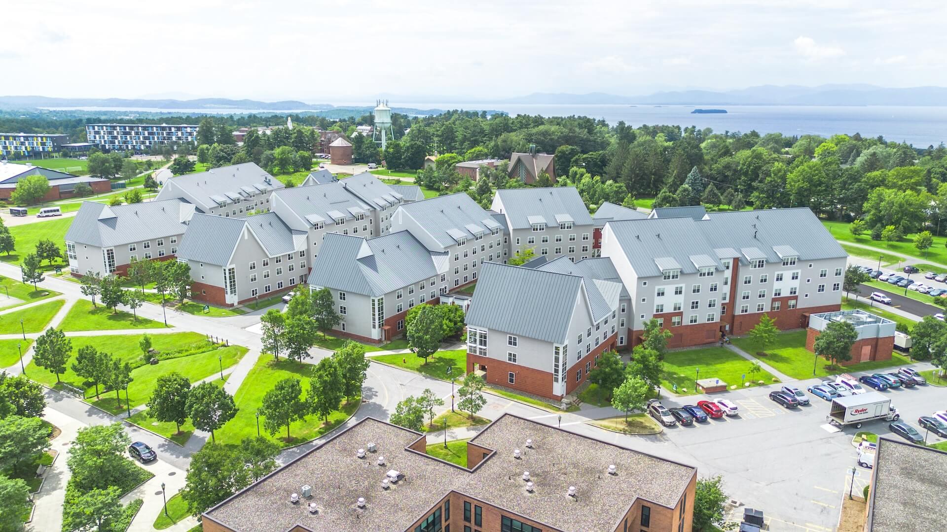 Aerial view of two building complexes featuring house-style residence halls.